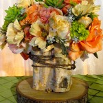 Greenscape Design Rustic Centrepiece with Birch and Peach Coral Lime and Champagne Flowers on a Tree Cookie